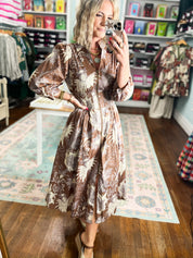 Mocha botanical midi dress with long sleeves, A-line skirt, and gathered waist
