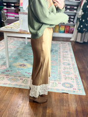 Camel satin midi skirt with lace-edged hem and straight draped silhouette