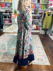 Floral tiered maxi dress with long sleeves and red-and-navy border