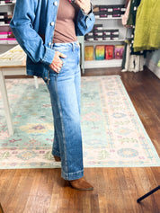 Dark wash wide-leg ankle jeans with slouchy straight fit, button and zipper front, belt loops