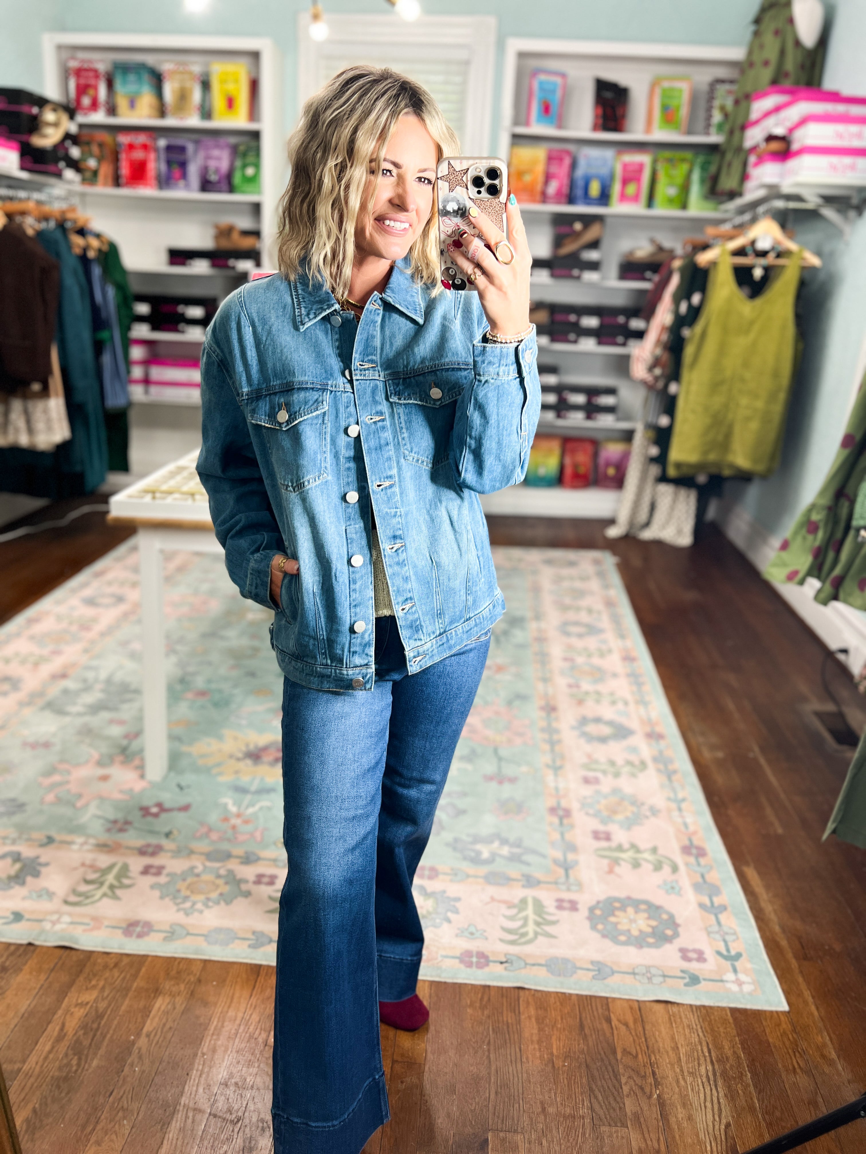 Light-wash denim jacket, relaxed oversized fit, long sleeves, chest flap pockets