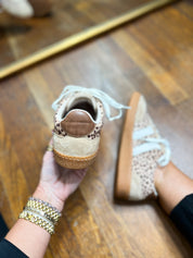 Back view of leopard-print mini sneakers with padded heel and white lace-up closure.