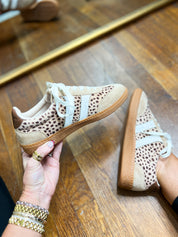 Leopard-print mini sneakers with white laces and tan sole, shown with matching pair.