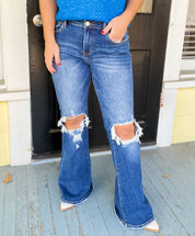 Risen Mid Rise Distressed Flare Jeans