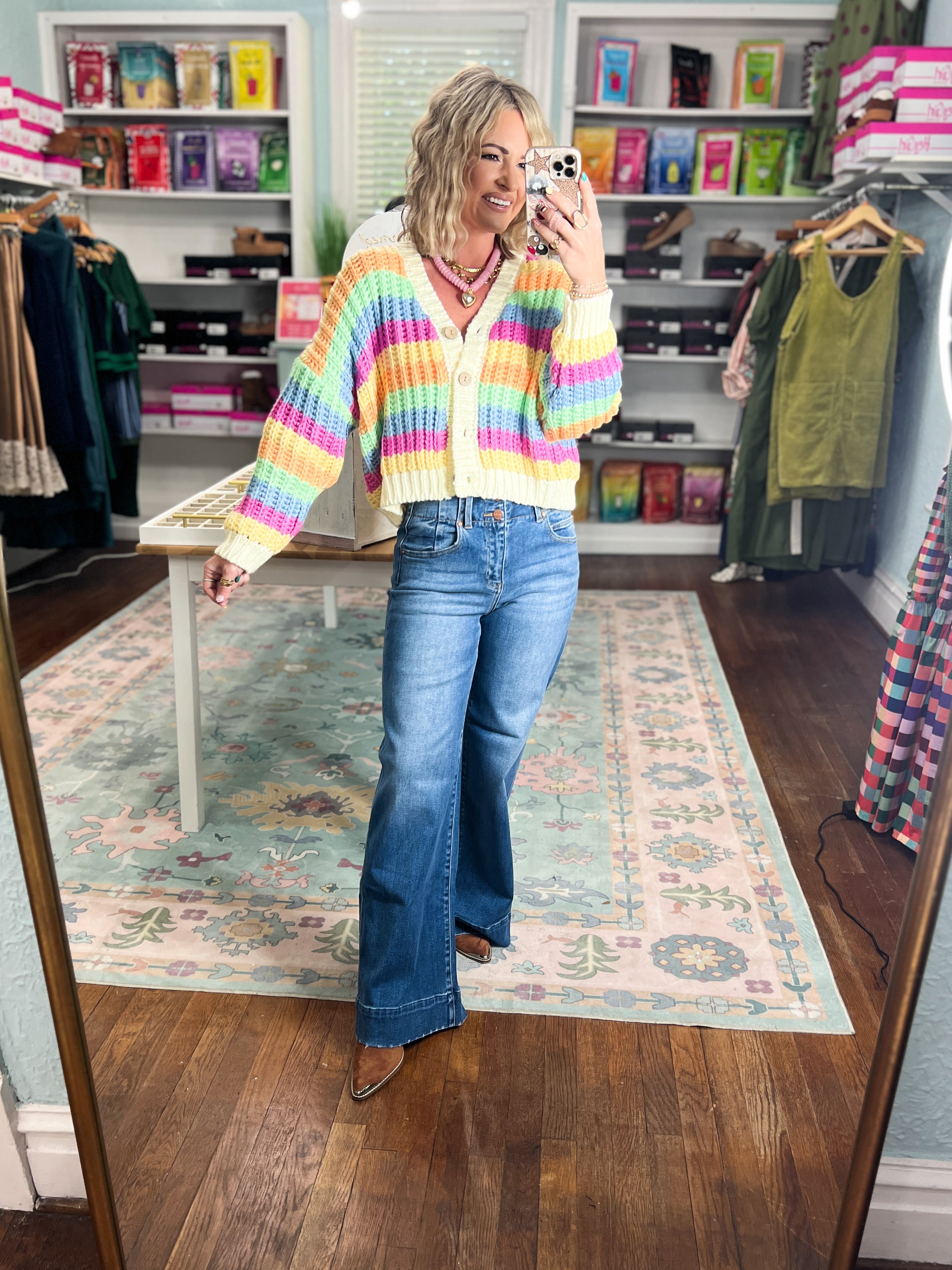 Rainbow striped cardigan, button-front V-neck with long sleeves, worn with blue jeans