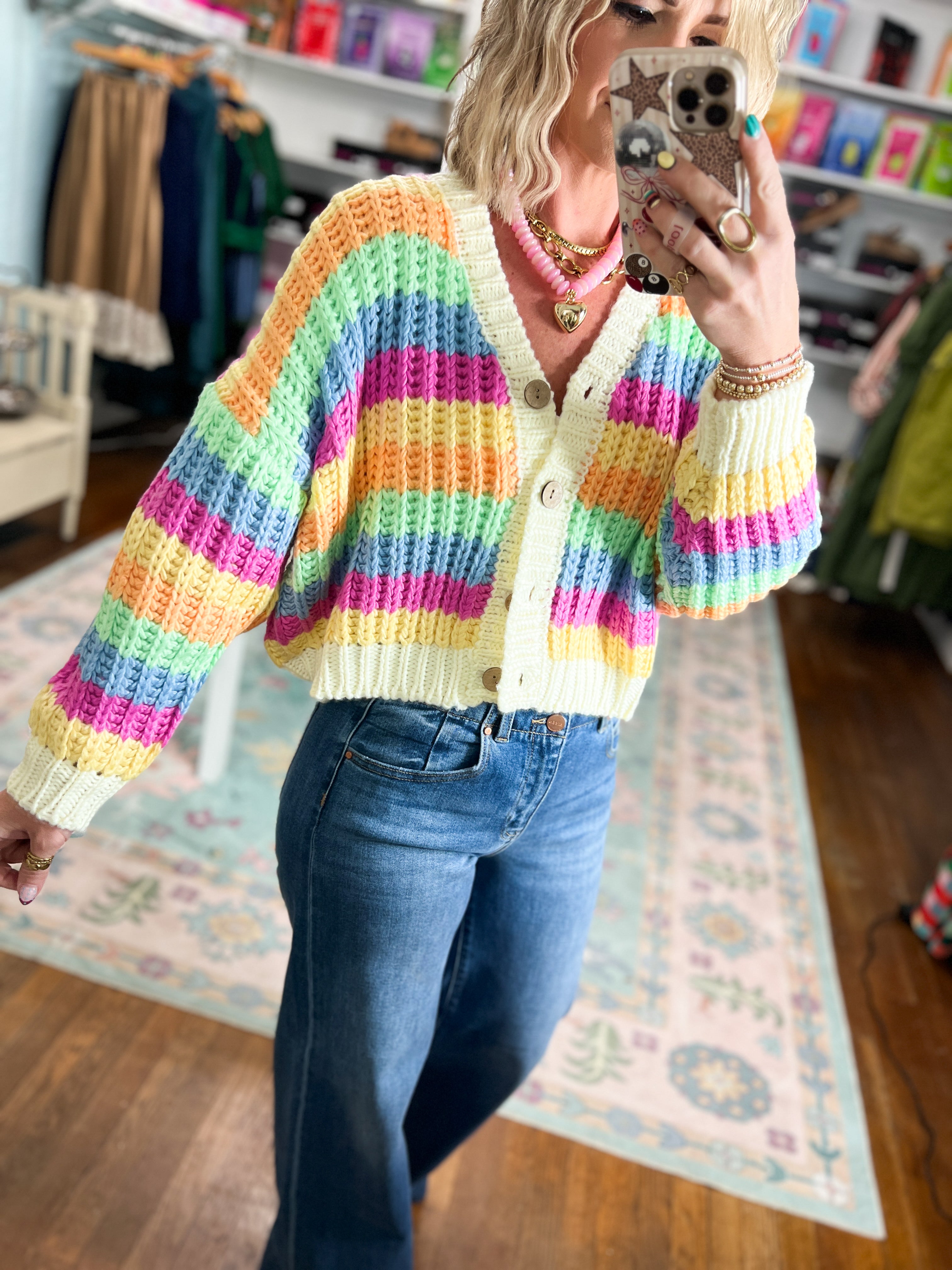 Rainbow striped cardigan detail: button front and V-neck with long sleeves