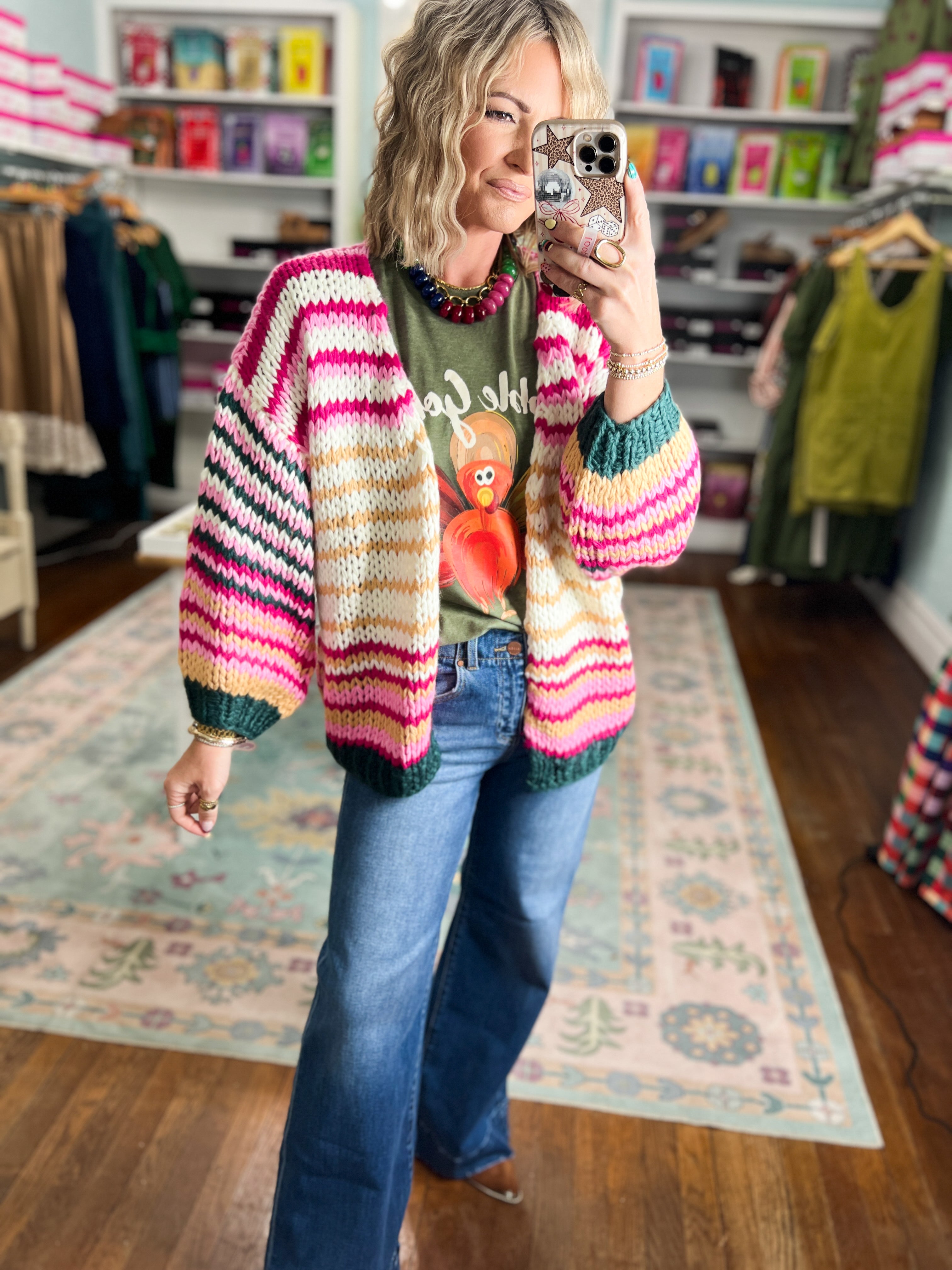 Multicolor striped knit cardigan with long sleeves, pink and cream chevron pattern