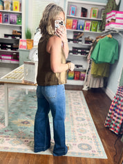 Brown sleeveless satin top with crew neck and front center seam, relaxed fit