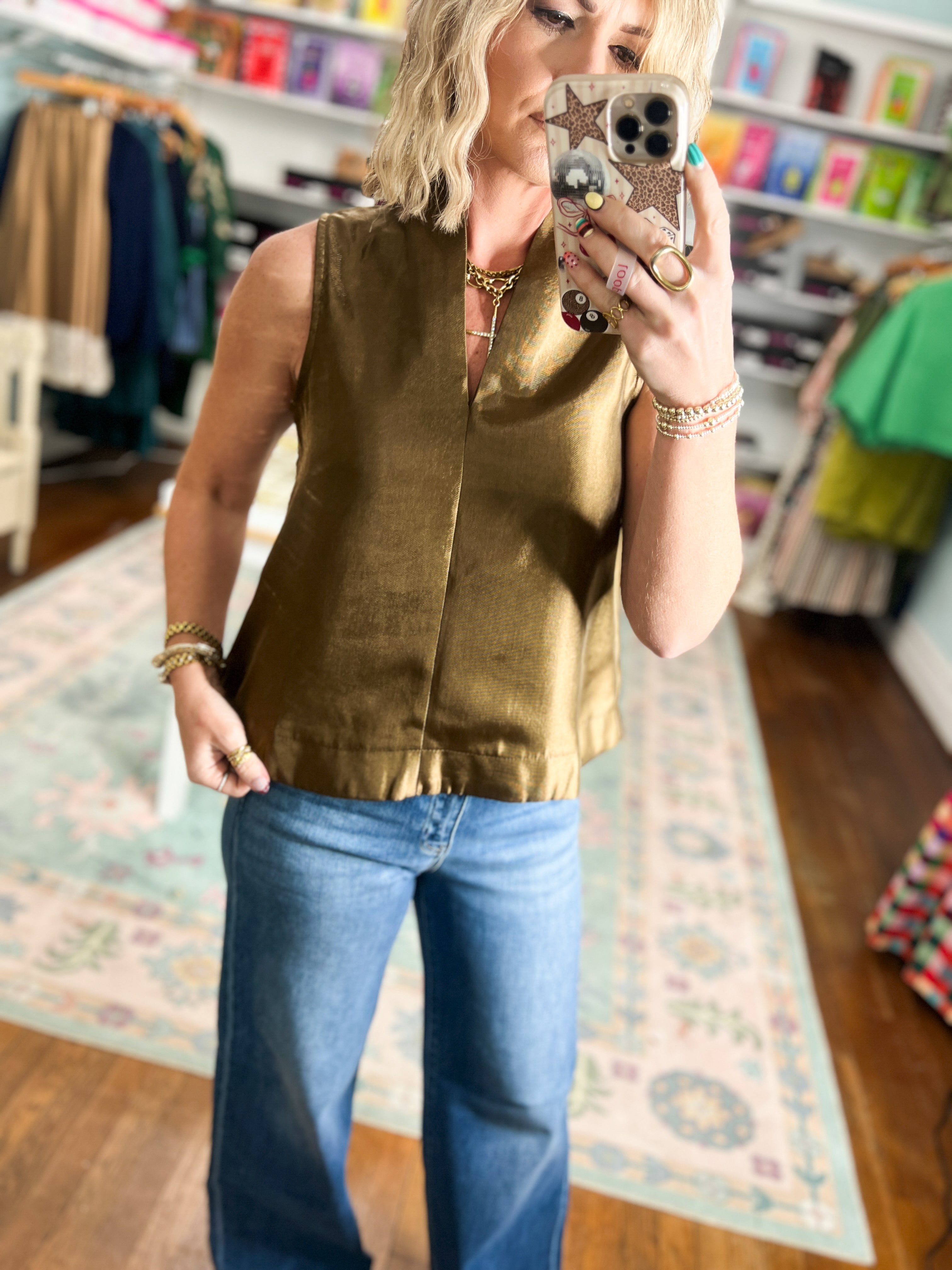 Brown sleeveless satin top with crew neck and center front seam detail