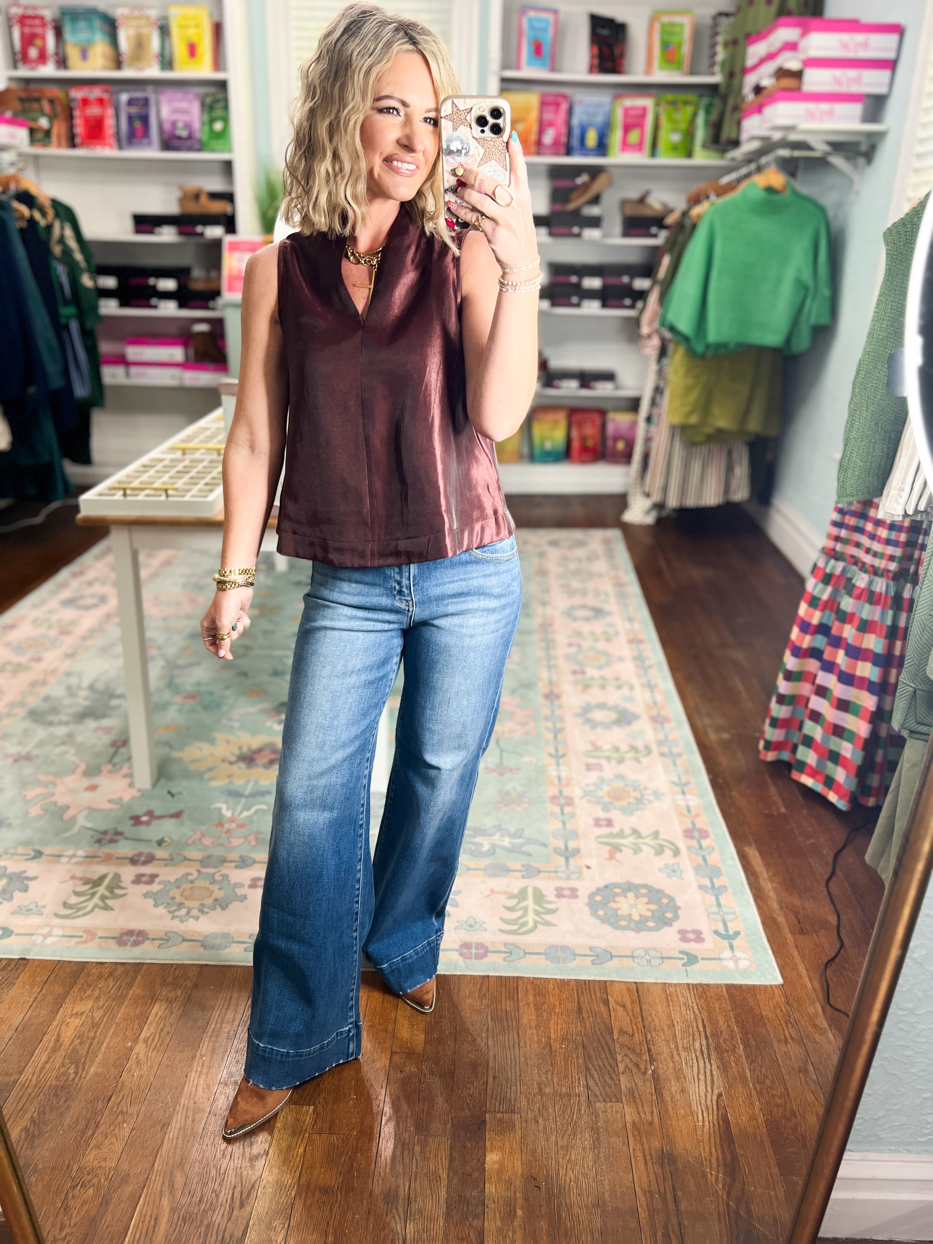 Burgundy satin-look sleeveless top with V-neck and straight hem