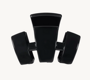 Black petite claw clip with three curved prongs, glossy finish